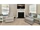 Cozy living room featuring a fireplace, comfortable seating, and neutral decor at 1291 Timber Bluff Rd, Westfield, IN 46074