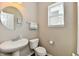 Charming powder room with pedestal sink, modern fixtures, and neutral paint at 1291 Timber Bluff Rd, Westfield, IN 46074