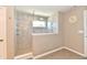 Beautiful walk-in shower features neutral tile, glass surround, and modern fixtures at 1291 Timber Bluff Rd, Westfield, IN 46074