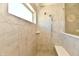 Elegant walk-in shower featuring neutral tile, glass surround, and rain shower head at 1291 Timber Bluff Rd, Westfield, IN 46074