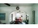 Open dining room area, neutral color palette, with archway to living room space at 1303 S Shipley St, Muncie, IN 47302