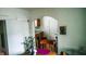 Bright dining room with archway, wood table, chandelier, and views to the kitchen area at 1303 S Shipley St, Muncie, IN 47302