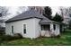 Well-maintained home featuring vinyl siding, modern windows, and manicured lawn at 1303 S Shipley St, Muncie, IN 47302