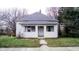 Charming single-story home with a covered front porch and freshly cut green lawn at 1303 S Shipley St, Muncie, IN 47302