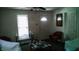 Bright living room featuring natural light, neutral color palette, and traditional furniture at 1303 S Shipley St, Muncie, IN 47302