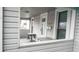 Covered front porch with a view of the entryway featuring seating area and covered entryway at 1303 S Shipley St, Muncie, IN 47302