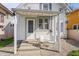 Rear porch features seating area with table and chairs at 1417 Sturm Ave, Indianapolis, IN 46201