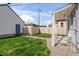 Backyard with green grass and access to the garage at 1417 Sturm Ave, Indianapolis, IN 46201