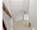View of basement stairs leading down to a door at 1417 Sturm Ave, Indianapolis, IN 46201