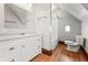 Bathroom featuring a white vanity, a shower/tub combo, and wood-look vinyl flooring at 1417 Sturm Ave, Indianapolis, IN 46201