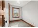 Small bedroom features a window, neutral carpet and wooden trim at 1417 Sturm Ave, Indianapolis, IN 46201