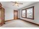Cozy bedroom with a ceiling fan, two windows, and hardwood trim at 1417 Sturm Ave, Indianapolis, IN 46201