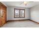 Bedroom features a window, neutral carpet and wooden trim at 1417 Sturm Ave, Indianapolis, IN 46201