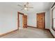Bedroom featuring a ceiling fan, neutral carpet and wooden trim at 1417 Sturm Ave, Indianapolis, IN 46201