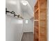 Walk-in closet with a small window and custom wooden shelving at 1417 Sturm Ave, Indianapolis, IN 46201