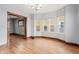 Bright dining room showcasing trim, hardwood floors, and many windows at 1417 Sturm Ave, Indianapolis, IN 46201