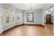 Sunlit dining room with hardwood floors and ample windows at 1417 Sturm Ave, Indianapolis, IN 46201