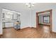 Dining room featuring hardwood floors, kitchen, and doorway at 1417 Sturm Ave, Indianapolis, IN 46201
