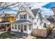 Attractive two-story home boasts a classic design and manicured landscaping at 1417 Sturm Ave, Indianapolis, IN 46201