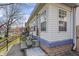 Side view of a charming home with a porch and well-maintained landscaping at 1417 Sturm Ave, Indianapolis, IN 46201