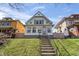 Charming two-story home with manicured lawn and a welcoming front porch at 1417 Sturm Ave, Indianapolis, IN 46201