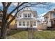 Charming two-story home with a well-maintained yard and inviting front entrance at 1417 Sturm Ave, Indianapolis, IN 46201