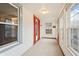 Spacious and well-lit front porch with multiple entry points and bright windows at 1417 Sturm Ave, Indianapolis, IN 46201