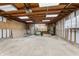 Spacious garage interior with lighting and storage, offering lots of room for your vehicles and equipment at 1417 Sturm Ave, Indianapolis, IN 46201