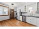 Updated kitchen with stainless appliances, modern cabinets, and hardwood floors at 1417 Sturm Ave, Indianapolis, IN 46201