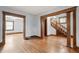 Open-concept living room showcases hardwood floors and classic wood detailing at 1417 Sturm Ave, Indianapolis, IN 46201