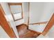 Wooden staircase leads up, with a carpeted landing at 1417 Sturm Ave, Indianapolis, IN 46201