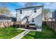 Spacious backyard with lush grass, deck, grill, and walkway at 1603 E Market St, Indianapolis, IN 46201