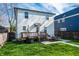 Backyard with deck, grill, and walkway to the house; basement entrance visible at 1603 E Market St, Indianapolis, IN 46201