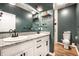Bathroom features double sink vanity with black hardware, and large mirror. Toilet and shower are visible at 1603 E Market St, Indianapolis, IN 46201