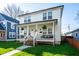 Charming two-story home with a welcoming front porch, manicured lawn, and inviting curb appeal at 1603 E Market St, Indianapolis, IN 46201
