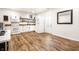 Cozy kitchen featuring a white refrigerator and ample counter space on hardwood floors at 1603 E Market St, Indianapolis, IN 46201
