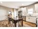 Bright kitchen showcasing stainless steel appliances, white cabinets, and a functional dining space at 1603 E Market St, Indianapolis, IN 46201