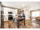 Spacious kitchen showcasing stainless steel appliances, white cabinetry, and an adjacent living area at 1603 E Market St, Indianapolis, IN 46201