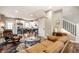 Warm living room flowing into the modern kitchen, featuring comfortable leather seating and stylish decor at 1603 E Market St, Indianapolis, IN 46201