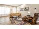 Cozy living room with comfortable leather furniture, hardwood flooring, and bright natural light at 1603 E Market St, Indianapolis, IN 46201