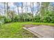 Expansive backyard with a patio area and mature trees provides a serene outdoor space at 1621 E 44Th St, Indianapolis, IN 46205