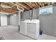 Finished basement with laundry area featuring a washer, dryer, and window for natural light at 1621 E 44Th St, Indianapolis, IN 46205