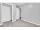 Neutral bedroom features carpeting, a closet, and an adjacent room via a white paneled door at 1621 E 44Th St, Indianapolis, IN 46205