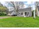 Charming one-story home with well-manicured lawn and a cozy front porch perfect for relaxing at 1621 E 44Th St, Indianapolis, IN 46205