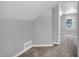 Hallway with gray walls and carpeted floors leading to a naturally lit room at 1621 E 44Th St, Indianapolis, IN 46205