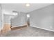 Spacious living room with hardwood floors and staircase with a pass-through to the kitchen at 1621 E 44Th St, Indianapolis, IN 46205