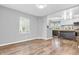 Open floor plan featuring hardwood floors and a passthrough to the kitchen at 1621 E 44Th St, Indianapolis, IN 46205