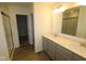 Modern bathroom with dual sinks, tile backsplash, and glass enclosed shower stall at 17026 Cowbell Dr, Noblesville, IN 46060