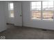 Neutral bedroom with a large window and open door at 17026 Cowbell Dr, Noblesville, IN 46060