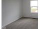 Bedroom featuring neutral carpet, white walls, and a window for natural light at 17026 Cowbell Dr, Noblesville, IN 46060
